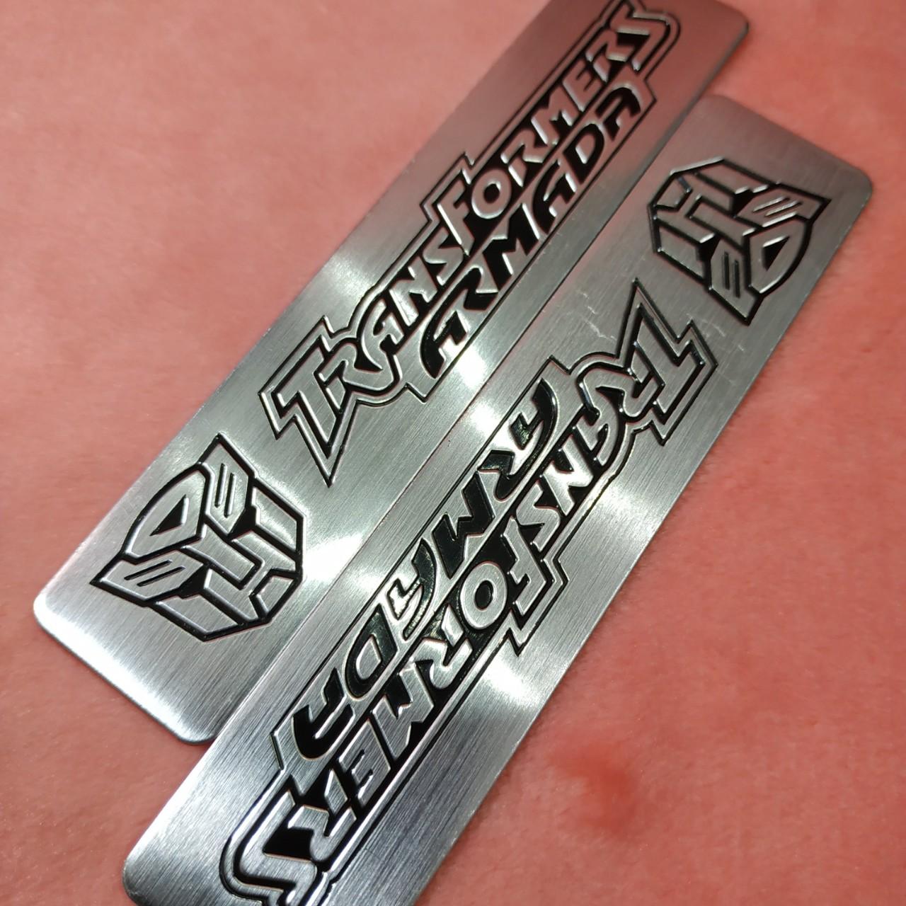 Tem nhôm dán xe TransFormer trắng dài 12x2.6cm