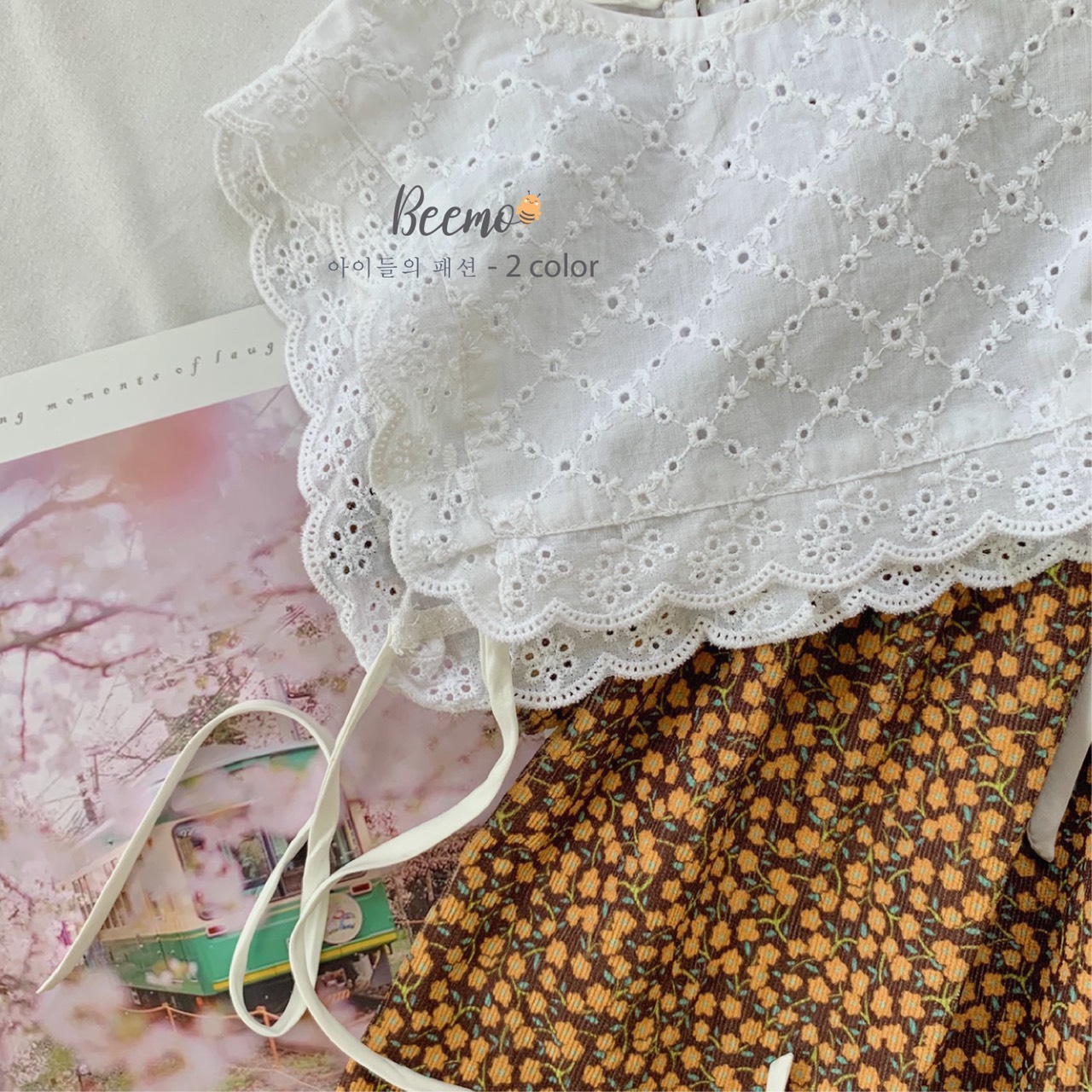 Set váy hoa và yếm bé gái