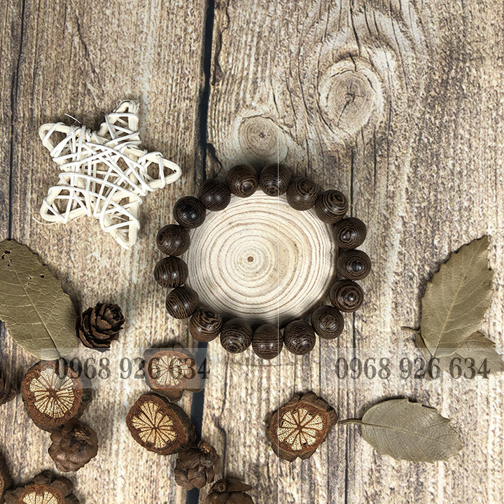 Vòng đeo tay hạt gỗ mun vân lông công - Chuỗi đeo tay gỗ mun 12 ly - Vòng phong thủy mang lại bình an và may mắn